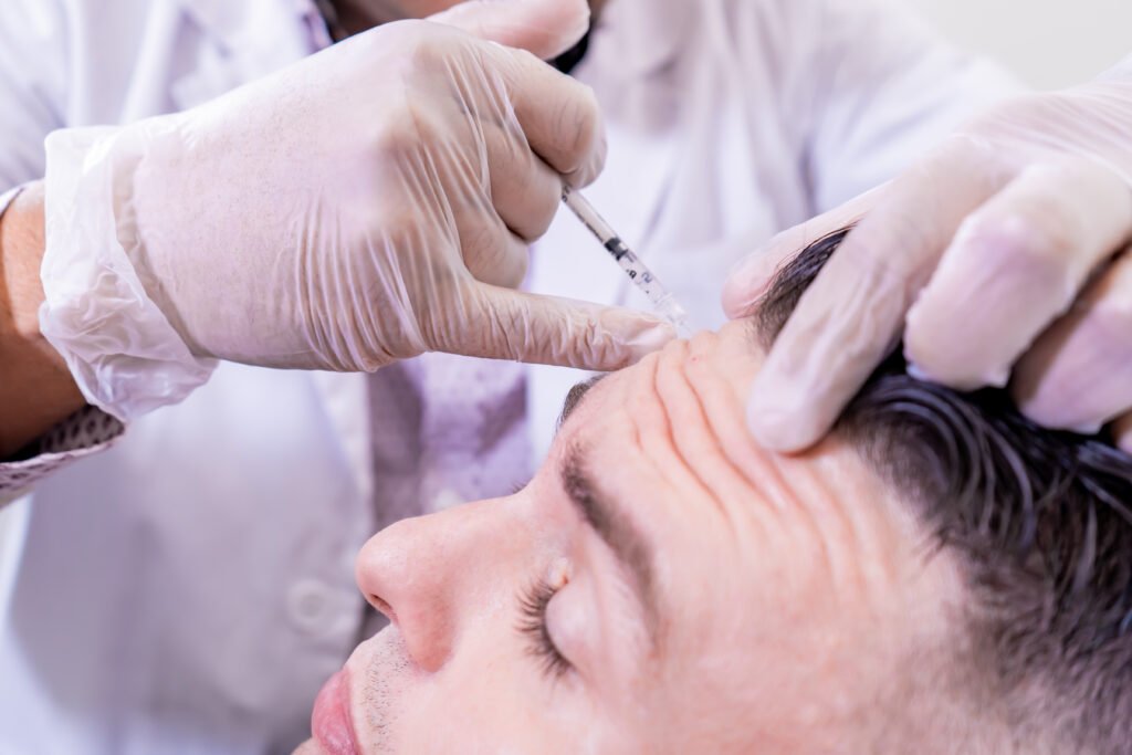 A man receiving a Forehead Botox Injection.